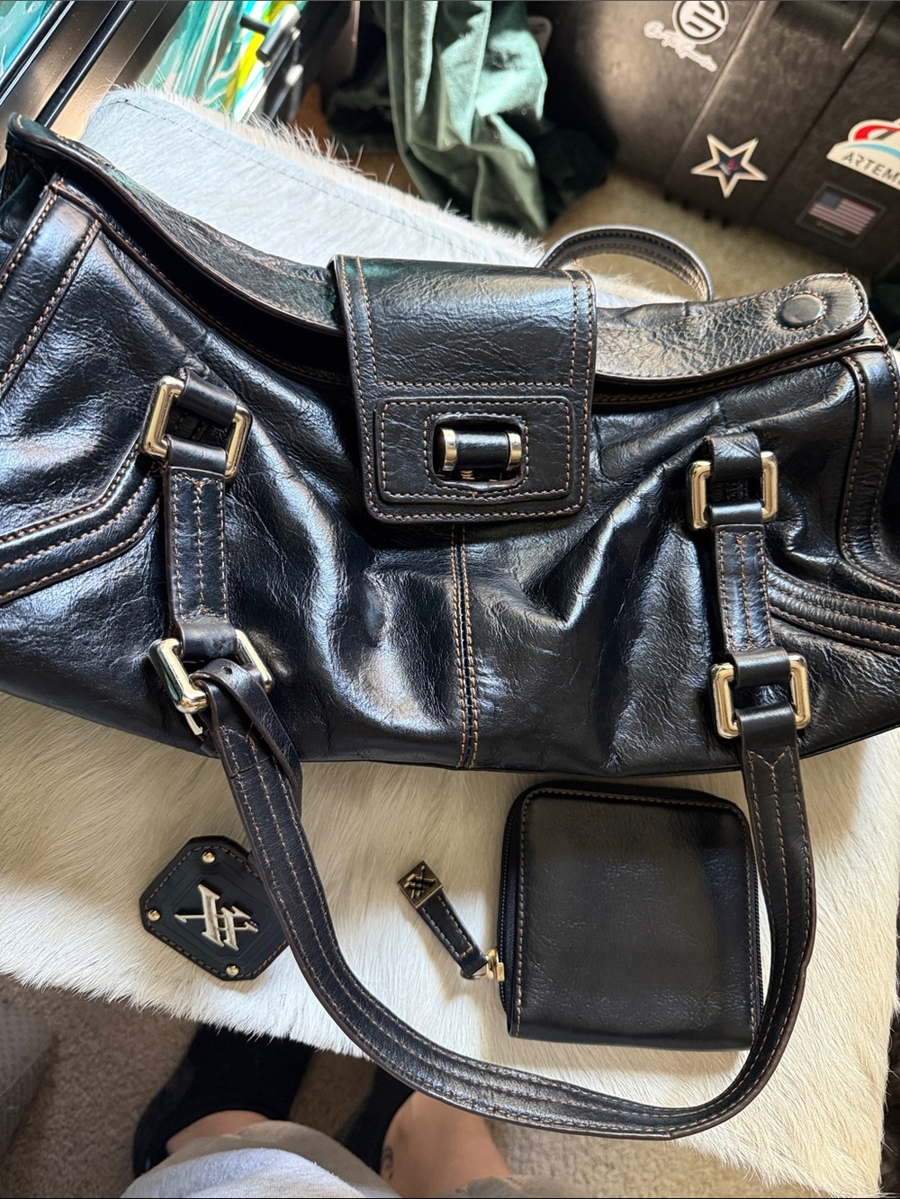 Sleek Black Leather Shoulder Bag with Gold-Tone Accents